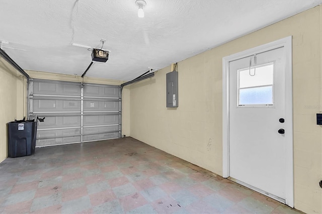 garage with a garage door opener and electric panel