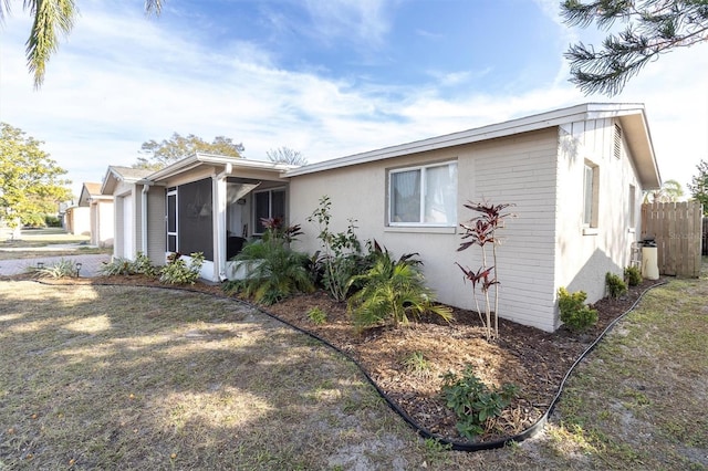 view of front of home featuring a garage and a front yard