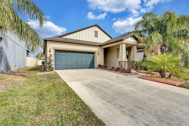 view of front of property featuring a garage and a front yard