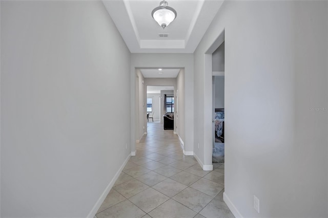 hallway with light tile patterned floors