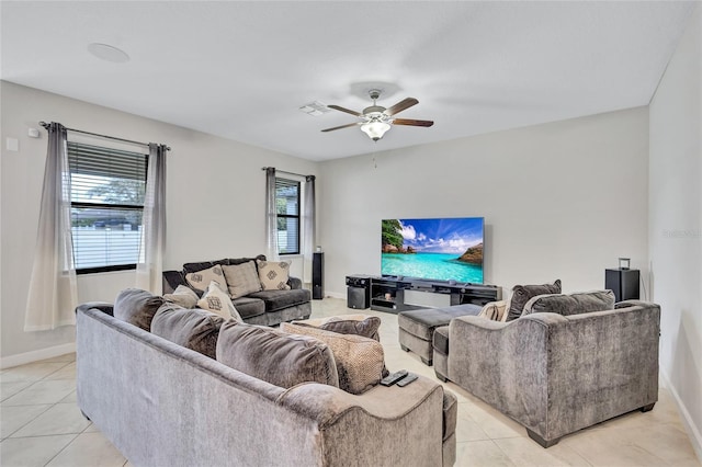 tiled living room featuring ceiling fan