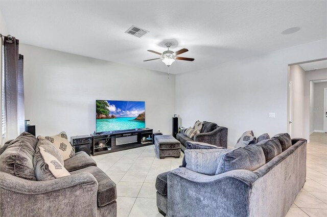 living room featuring ceiling fan and light tile patterned floors