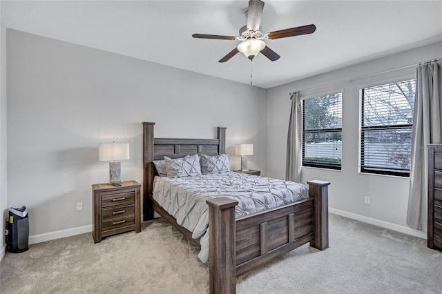 bedroom with light colored carpet and ceiling fan