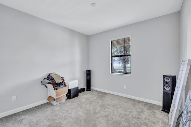 empty room with light colored carpet