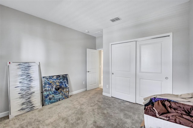 carpeted bedroom with a closet