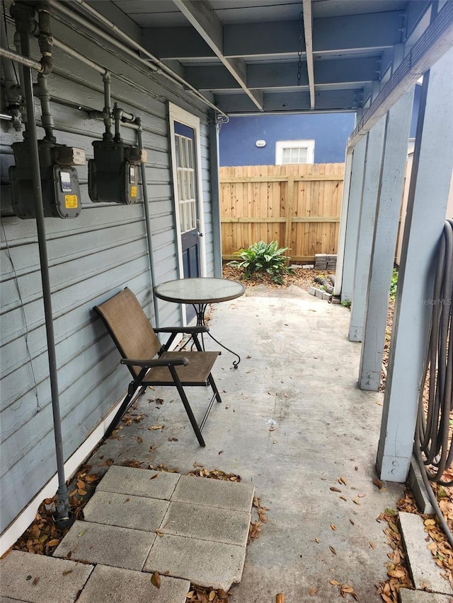 view of patio / terrace featuring fence