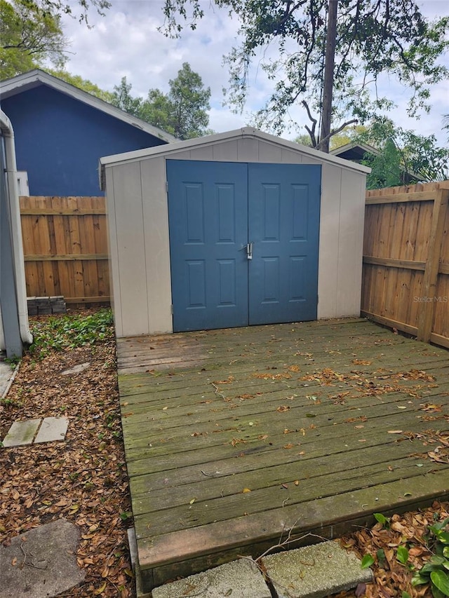 view of shed with a fenced backyard