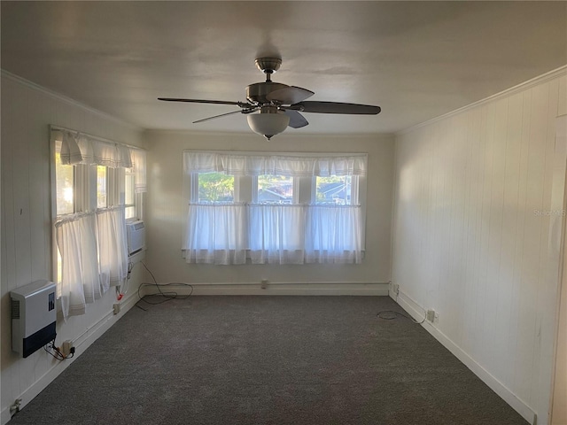 unfurnished room featuring ornamental molding, a ceiling fan, heating unit, cooling unit, and carpet flooring