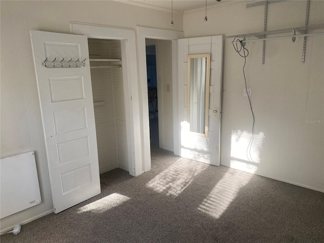 unfurnished bedroom featuring a closet and carpet