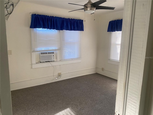 carpeted empty room featuring cooling unit, baseboards, and ceiling fan