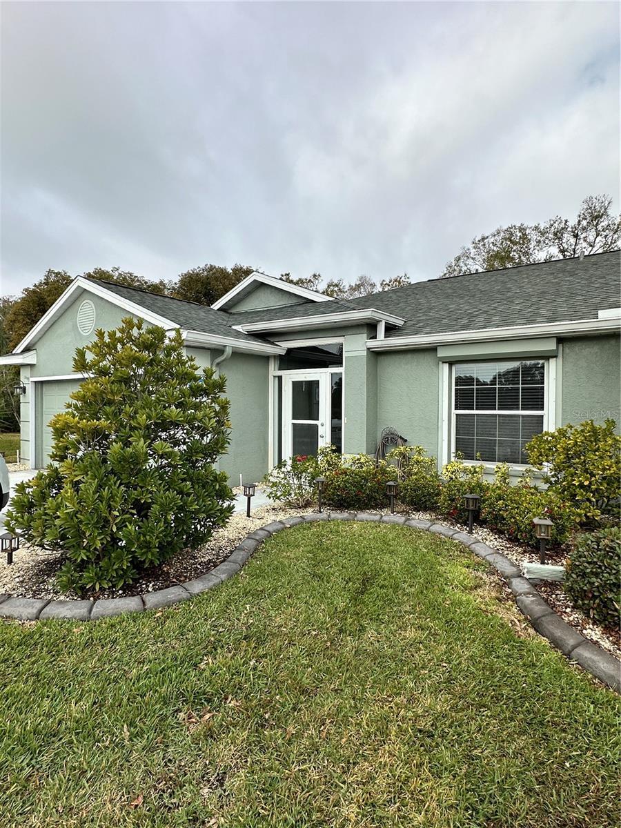 view of home's exterior featuring a yard and a garage