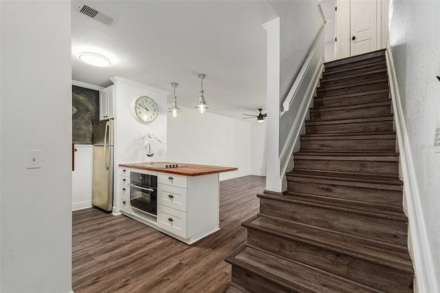 interior space with hardwood / wood-style flooring and ceiling fan