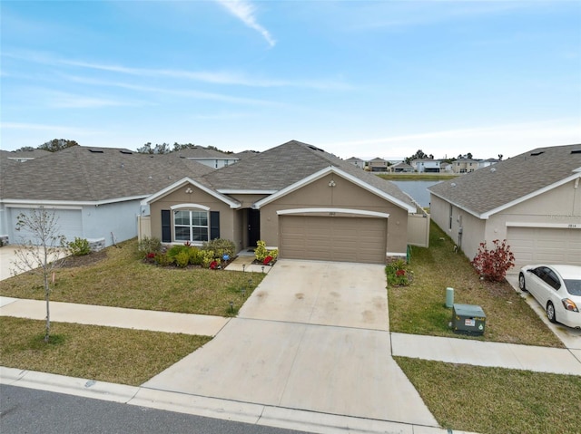 ranch-style home with a garage and a front yard