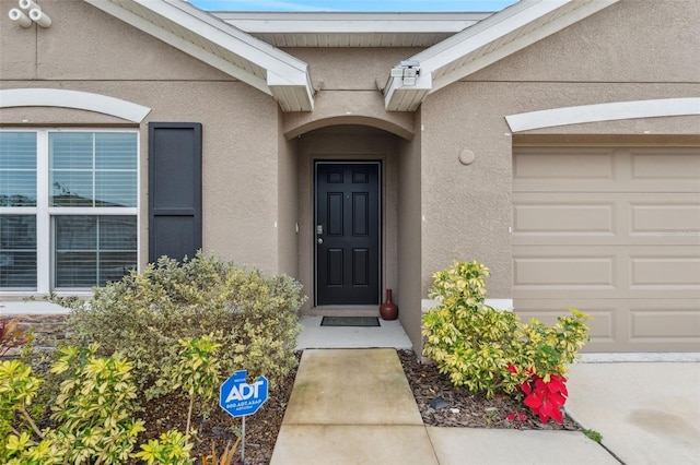 property entrance featuring a garage