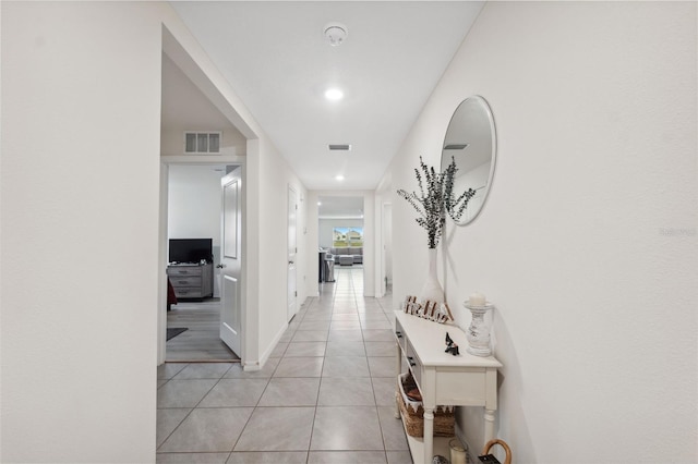 corridor featuring light tile patterned flooring