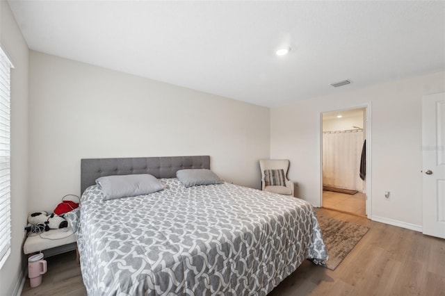 bedroom featuring light hardwood / wood-style flooring