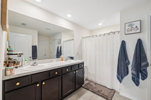 bathroom with vanity and tile patterned floors