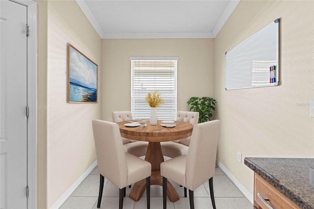 tiled dining room featuring ornamental molding