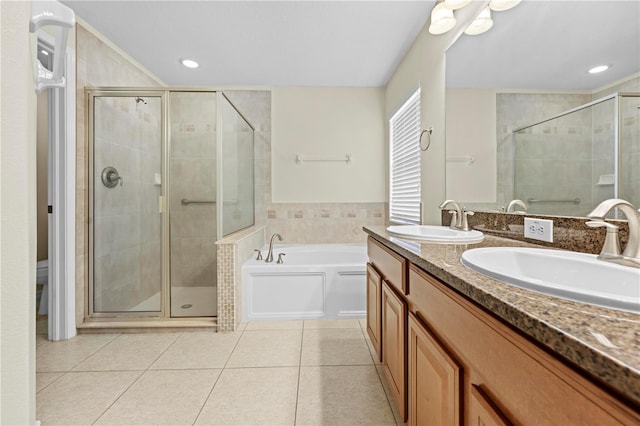 full bathroom with tile patterned floors, toilet, independent shower and bath, and vanity