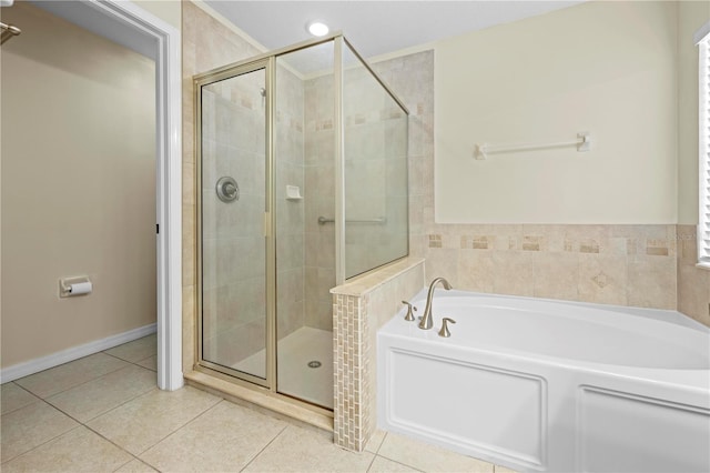 bathroom with tile patterned flooring and independent shower and bath