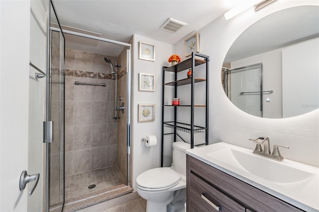 bathroom featuring walk in shower, vanity, and toilet