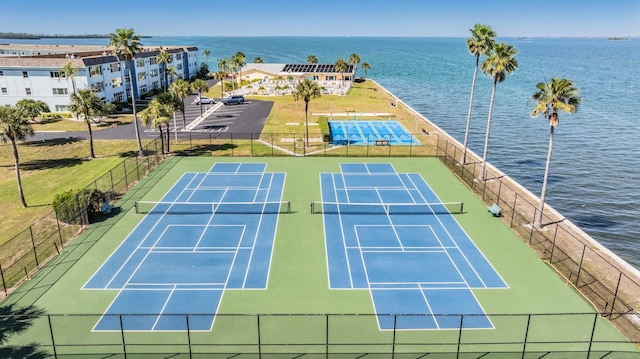 view of sport court with a water view