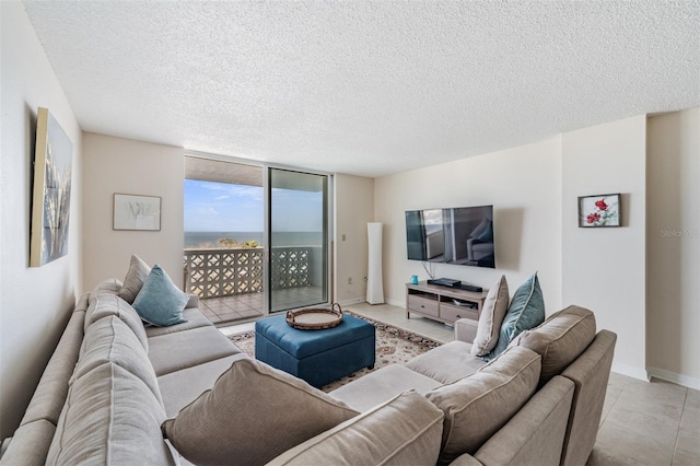 living room with expansive windows and a textured ceiling