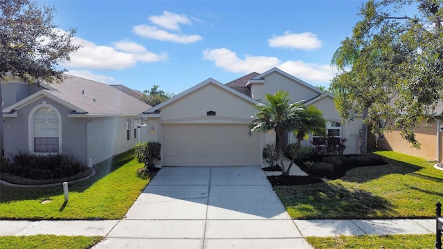 view of front of property with a garage and a front yard