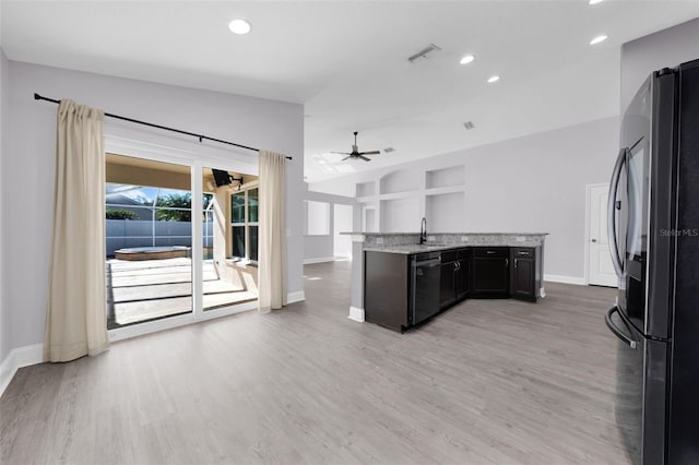 kitchen featuring dishwasher, black fridge, hardwood / wood-style floors, and ceiling fan