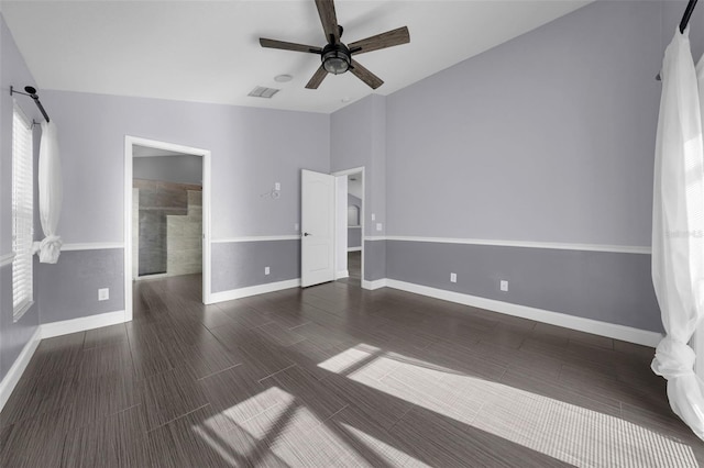 spare room featuring lofted ceiling and ceiling fan