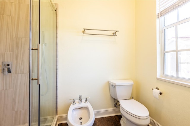 bathroom featuring a bidet, hardwood / wood-style floors, a shower with door, and toilet