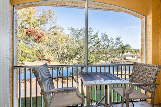 balcony featuring a water view