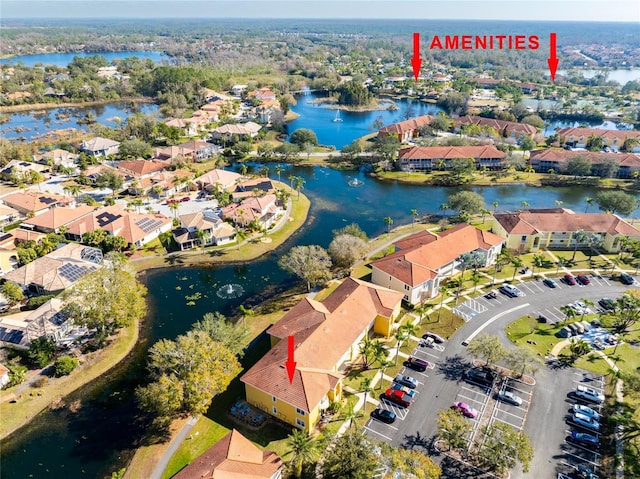 birds eye view of property featuring a water view