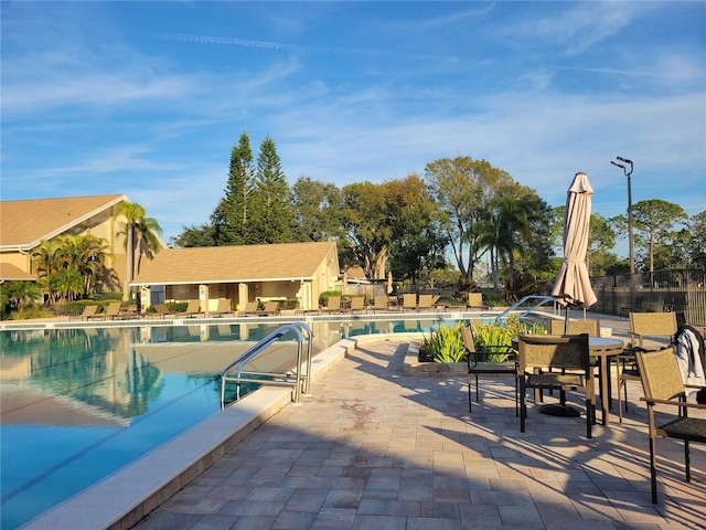 view of swimming pool featuring a patio area