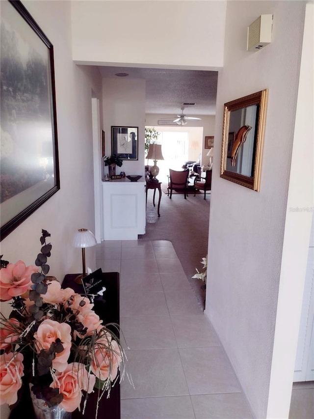 hallway with tile patterned floors