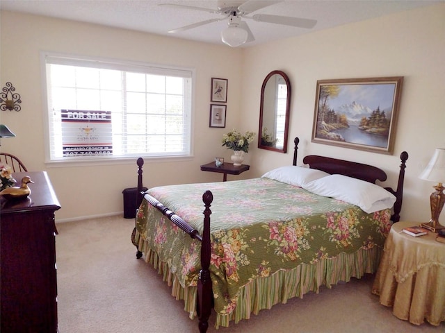 bedroom with light colored carpet and ceiling fan