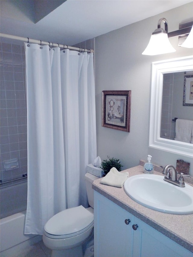 full bathroom featuring vanity, shower / bath combination with curtain, and toilet