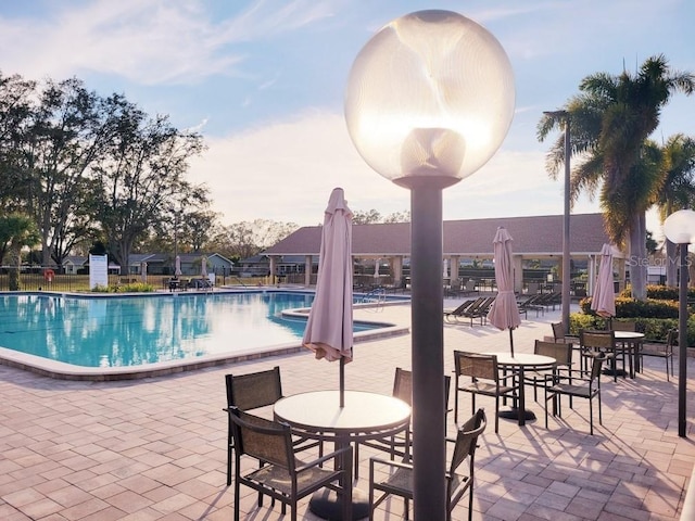 view of swimming pool featuring a patio area