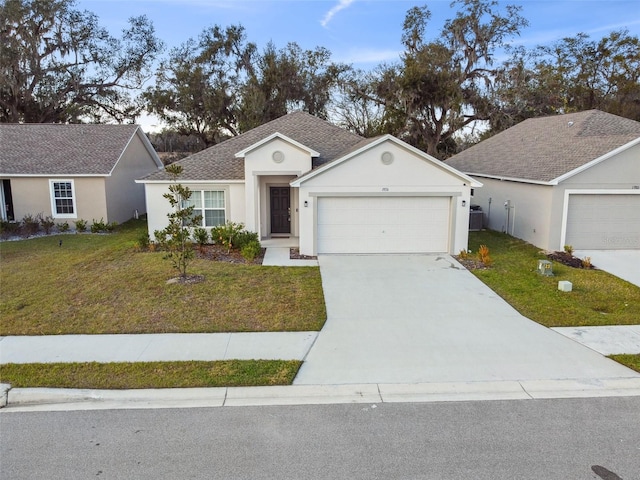 ranch-style home featuring cooling unit, a garage, and a front lawn