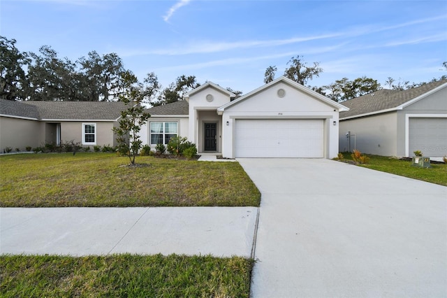 ranch-style house featuring a garage and a front lawn