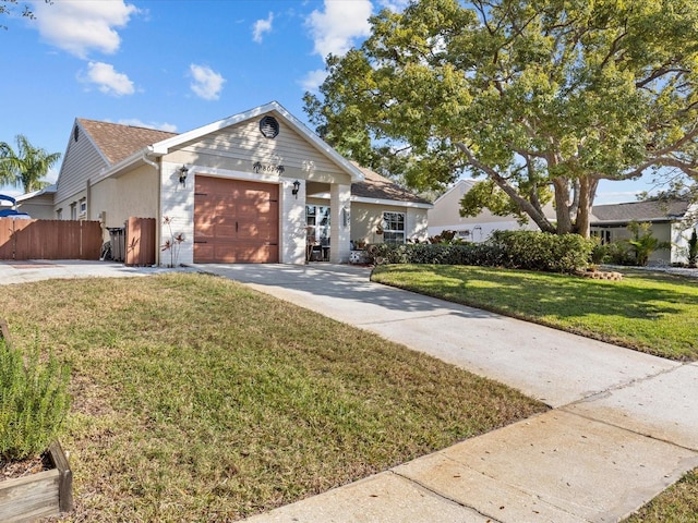 view of front of home with a garage and a front lawn