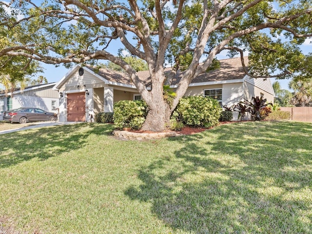 view of front of house featuring a garage and a front yard