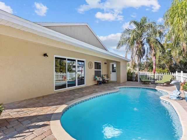 view of pool featuring a patio