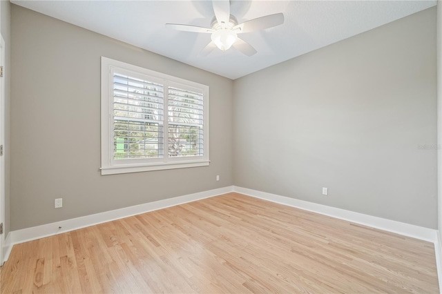 empty room featuring ceiling fan and light hardwood / wood-style floors