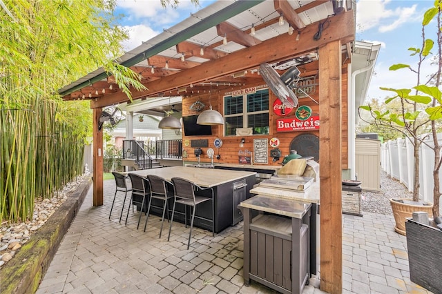 view of patio featuring a bar