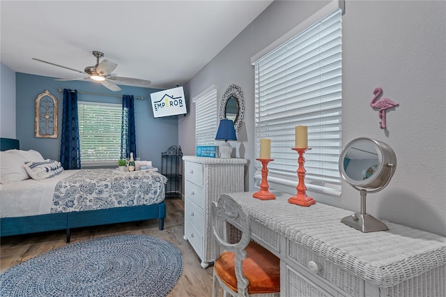 bedroom featuring ceiling fan and light hardwood / wood-style flooring