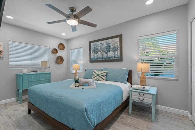 bedroom with hardwood / wood-style flooring and ceiling fan