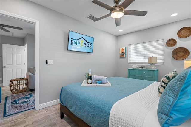 bedroom featuring ceiling fan and light hardwood / wood-style flooring