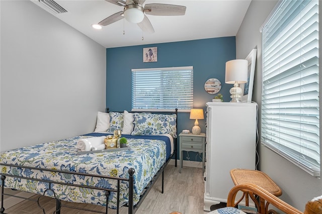 bedroom featuring ceiling fan and light hardwood / wood-style flooring