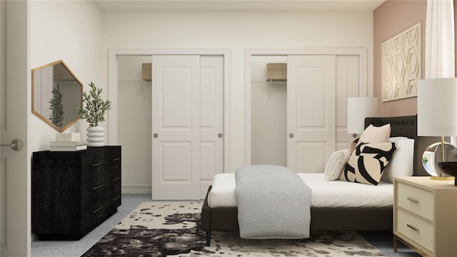 bedroom featuring carpet flooring and two closets